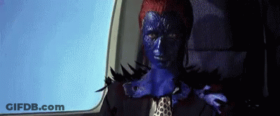 A Woman With Blue Paint On Her Face Is Sitting In A Car . GIF