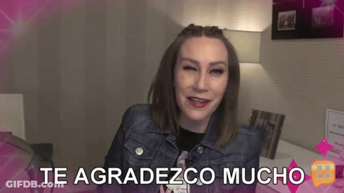 A Woman With Braces On Her Te Agradezco Mucho Sign GIF