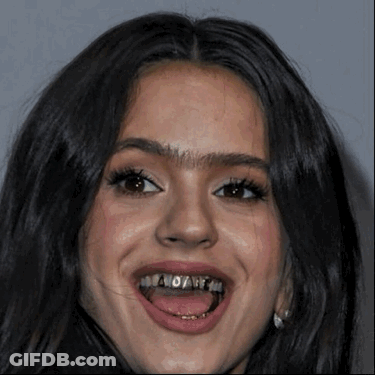 A Woman With Braces On Her Teeth Is Smiling With Her Mouth Open GIF