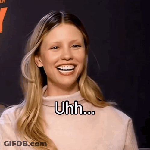 A Woman With Braces On Her Teeth Is Smiling With The Words Uhh Written On Her Face GIF