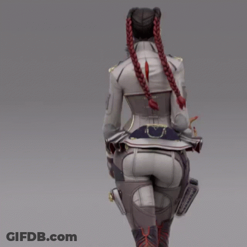 A Woman With Braids In Her Hair Is Walking GIF