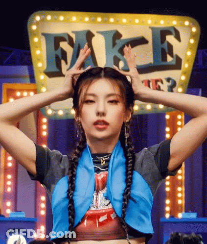 A Woman With Braids Is Standing In Front Of A Sign That Says Fake GIF