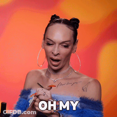 A Woman With Colorful Nails Is Holding Her Hands Together And Says Oh My GIF
