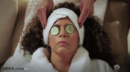 A Woman With Cucumber Slices On Her Eyes Is Getting A Massage From Sunnyside GIF