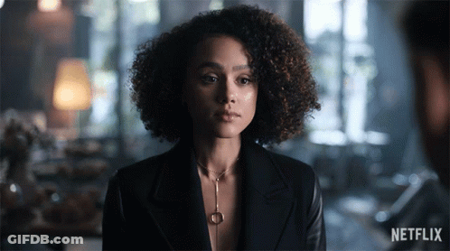 A Woman With Curly Hair And A Netflix Logo On The Bottom GIF