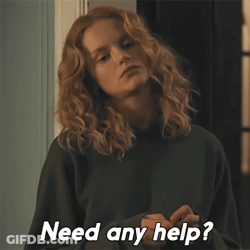 A Woman With Curly Hair Is Asking If She Needs Help GIF