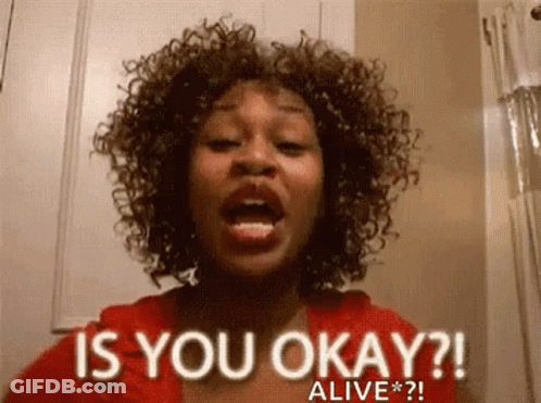 A Woman With Curly Hair Is Asking Is You Okay ? Alive * ? . GIF
