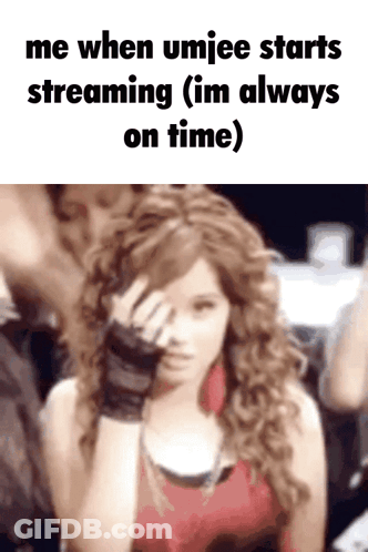 A Woman With Curly Hair Is Covering Her Face With Her Hand And Says Me When Umjee Starts Streaming ( Im Always On Time GIF