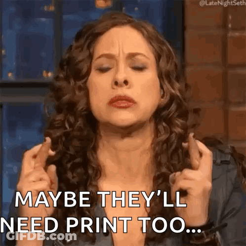 A Woman With Curly Hair Is Crossing Her Fingers And Saying Maybe They 'Ll Need Print Too ... GIF