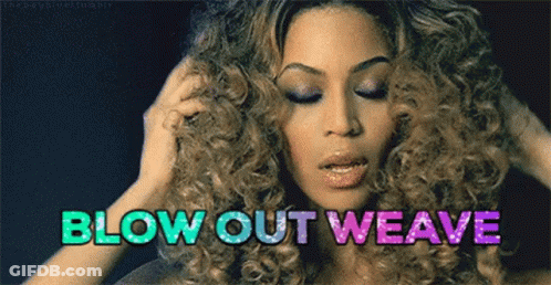 A Woman With Curly Hair Is Holding Her Hair And The Words Blow Out Weave Are Above Her Head . GIF
