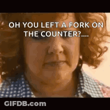 A Woman With Curly Hair Is Looking At The Camera And Says `` Oh You Left A Fork On The Counter ? '' GIF