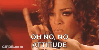 A Woman With Curly Hair Is Making A Funny Face And Giving A Thumbs Down Sign . GIF