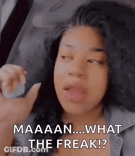 A Woman With Curly Hair Is Making A Funny Face And Saying What The Freak . GIF