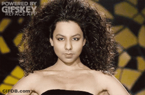 A Woman With Curly Hair Is Powered By Gifkey GIF
