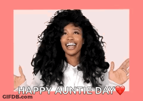 A Woman With Curly Hair Is Smiling And Holding Her Hands Out In Front Of Her Face . GIF