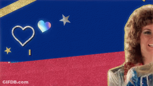 A Woman With Curly Hair Is Smiling In Front Of A Blue And Red Background GIF
