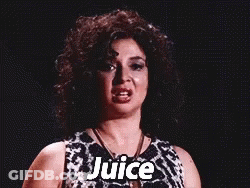 A Woman With Curly Hair Is Wearing A Black And White Dress And Necklace And Says Juice . GIF