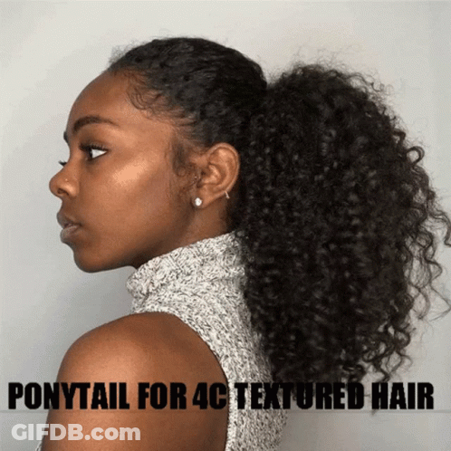 A Woman With Curly Hair Is Wearing A Ponytail For Textured Hair GIF