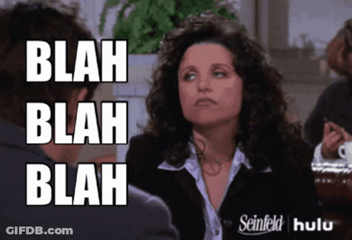 A Woman With Curly Hair Says Blah Blah Blah In Front Of A Man GIF