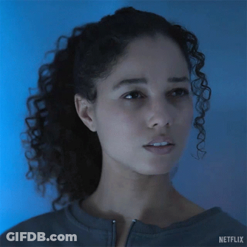 A Woman With Curly Hair Says Come Again On A Netflix Ad GIF