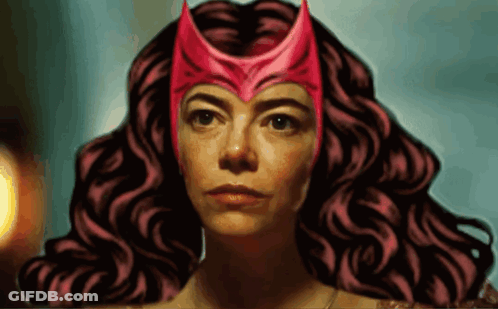 A Woman With Curly Hair Wearing A Red Helmet GIF
