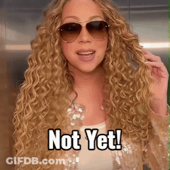 A Woman With Curly Hair Wearing Sunglasses And A Caption That Says Not Yet GIF