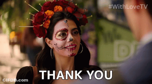 A Woman With Day Of The Dead Makeup On Her Face Is Saying Thank You GIF