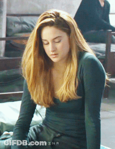 A Woman With Divergent China Written On The Bottom GIF