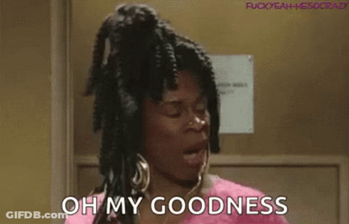A Woman With Dreadlocks And Earrings Is Standing In A Doorway And Saying `` Oh My Goodness '' . GIF