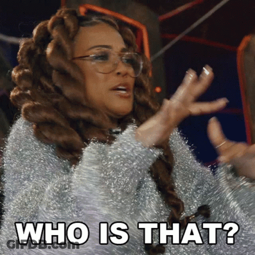 A Woman With Dreadlocks And Glasses Says " Who Is That " GIF