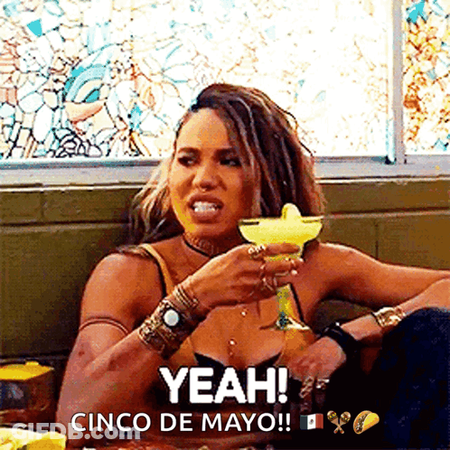 A Woman With Dreadlocks Is Drinking A Margarita And Says Yeah Cinco De Mayo GIF