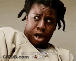 A Woman With Dreadlocks Is Making A Funny Face And Says `` Well Ain T Dat Boutta Pause '' . GIF