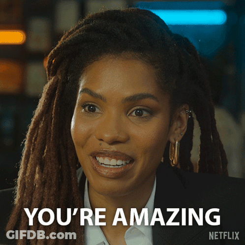 A Woman With Dreadlocks Is Smiling And Says You 'Re Amazing On The Bottom GIF