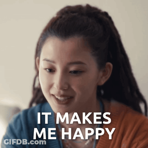 A Woman With Dreadlocks Is Smiling With The Words It Makes Me Happy Above Her GIF