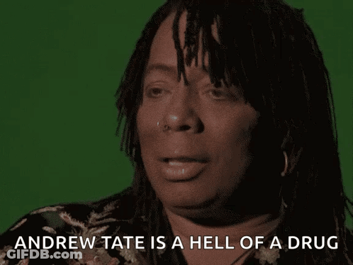 A Woman With Dreadlocks Is Talking About Andrew Tate GIF
