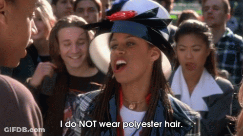 A Woman With Dreadlocks Wearing A Graduation Cap And Gown Says I Do Not Wear Polyester Hair . GIF