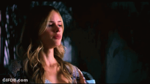 A Woman With Duct Tape On Her Mouth Is Being Held By A Stuffed Animal GIF