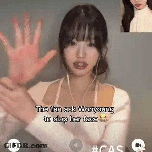 A Woman With Ear Buds Holds Her Hand Up In Front Of Her Face And Says The Fan Ask Wonyoung To Slap Her Face GIF