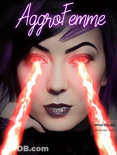 A Woman With Fire Coming Out Of Her Eyes And The Words Aggro Femme GIF