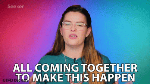 A Woman With Glasses And A Blue Shirt Says All Coming Together To Make This Happen GIF