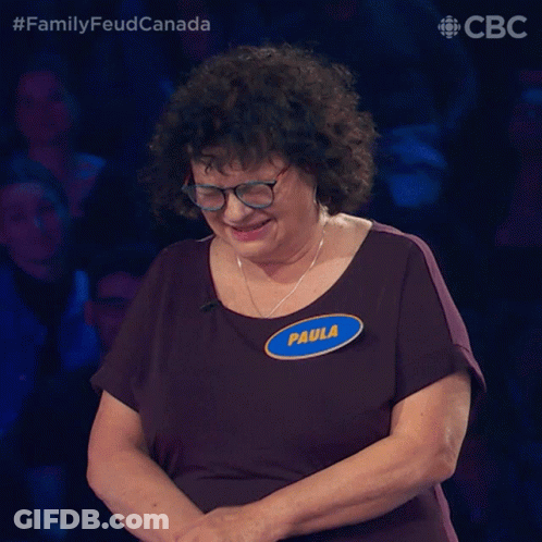 A Woman With Glasses And A Name Tag That Says Paula On It GIF