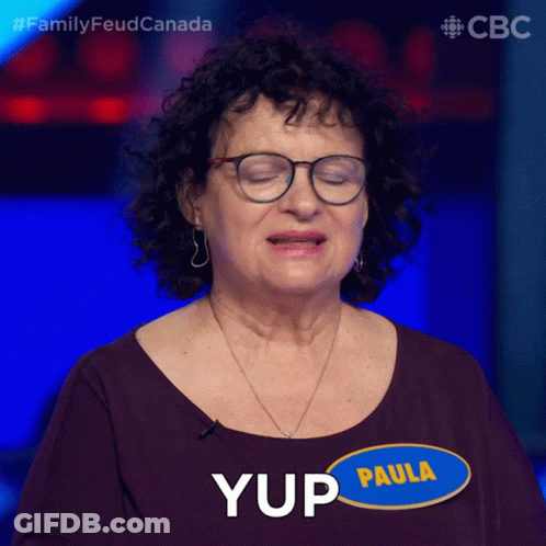 A Woman With Glasses And A Name Tag That Says Paula On It GIF