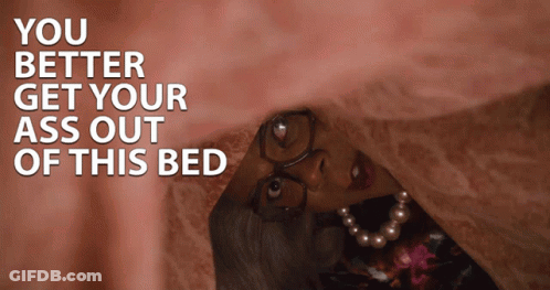 A Woman With Glasses And A Pearl Necklace Is Hiding Under A Blanket With The Words You Better Get Your Ass Out GIF