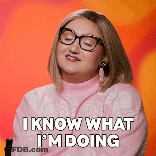 A Woman With Glasses And A Pink Sweater Says " I Know What I 'M Doing " GIF
