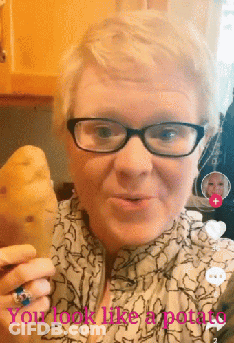 A Woman With Glasses Is Holding A Potato With The Words " You Look Like A Potato " Above Her GIF