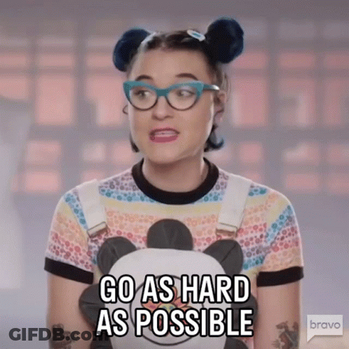 A Woman With Glasses Is Holding A Stuffed Panda Bear And Says Go As Hard As Possible GIF