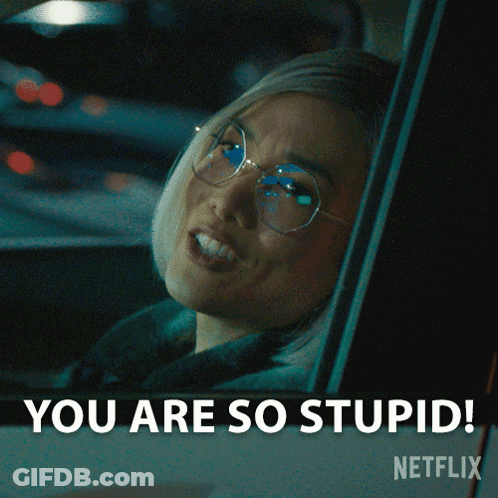 A Woman With Glasses Is Sitting In A Car And Says You Are So Stupid GIF