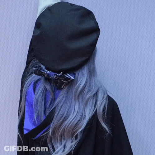 A Woman With Gray Hair Wearing A Black Beret GIF