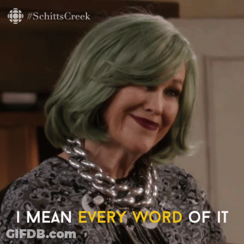 A Woman With Green Hair And A Necklace Says I Mean Every Word Of It GIF
