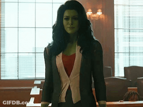 Woman With Green Hair And Skin In Courtroom GIF